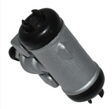 Brake cylinder by DGT Agri for Kawasaki Mule 600/610/SX, gray metal body with black end caps