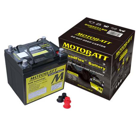 Motobatt MBTZ26RHD battery beside its black packaging box, featuring a yellow label on the case.