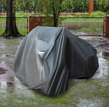 ATV cover, large gray protective outdoor shelter for a recreational vehicle.