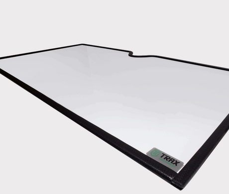 Glass windscreen for Honda SXS520 Pioneer, new style; clear panel with black edge trim and TRAX logo tag.