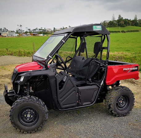Cab roof, windscreen and wiper kit for Honda SXS520 Pioneer; red and black UTV with cab enclosure and Pioneer branding.