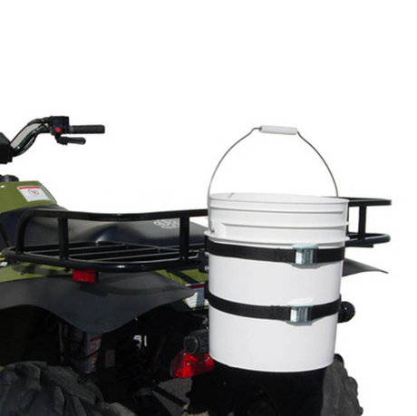 Bucket Binder on Can-Am Outlander ATV rear rack; white plastic bucket secured with two black straps.