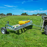 C-Dax Eliminator Weed Wiper 2.4m trailer on steel frame with yellow unit, hitched to tractor
