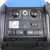 Pressure washer control panel by Hyundai on a blue body, with two black knobs, pressure gauge, and power switch.