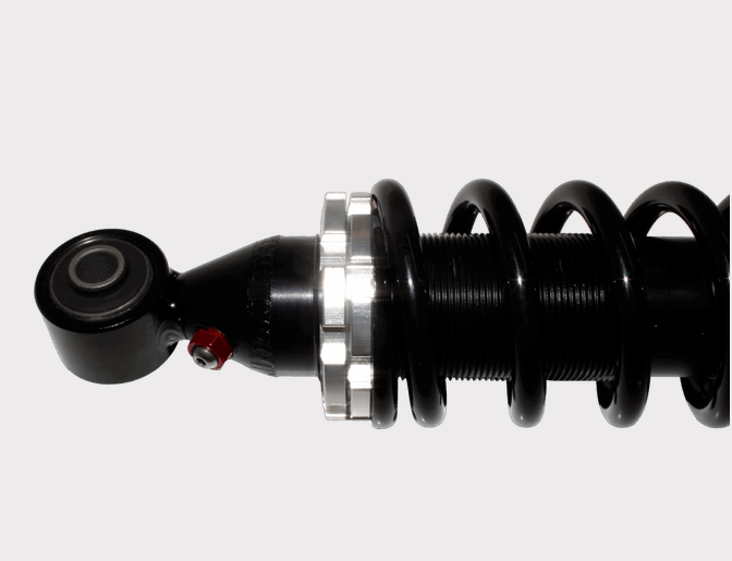 Hyper Front Shock absorber for Kubota RTV 400/500/900/1100, black coil-spring body with silver mounting nut.