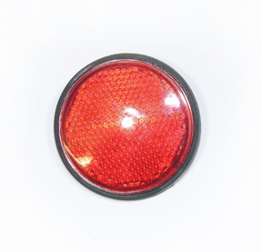Round red reflector with black rim for vehicle safety equipment