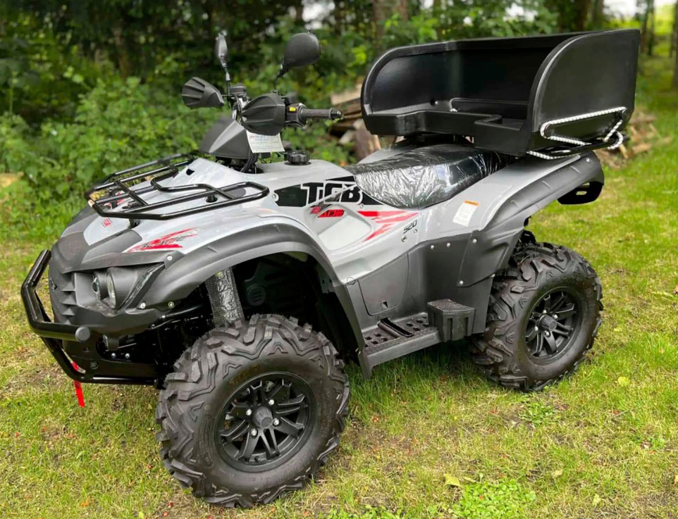 Wydale ATV dog box, black, by DGT Agri on a gray ATV with rear cargo rack