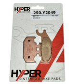 Brake pads set by Hyper, sintered copper-colored ATV front/rear pads in blister pack.