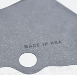 Stator Cover Gasket, dark gray metal with a circular mounting hole