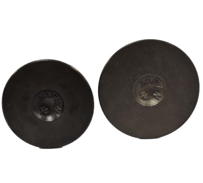 Engine valve pair, two dark metal valves stamped JAPAN