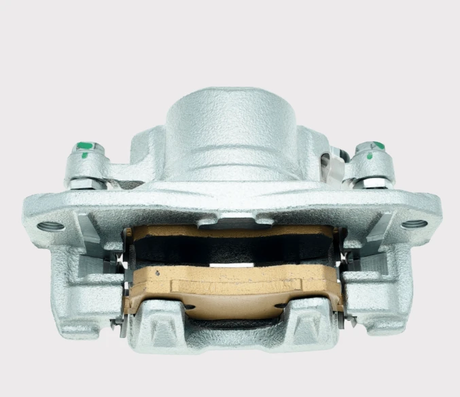 Front Left Brake Caliper, silver metal body with tan brake pad visible