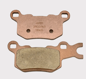 Rear Left brake pads pair for Can-Am Traxter 2016-2017 (HD5/HD8/HD10 2017, Commander); copper backing, ATV City
