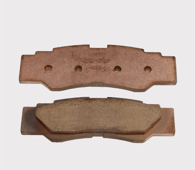 Rear YXZ 1000 brake pad set (2 pcs); copper-colored friction pads with Hyper stamp