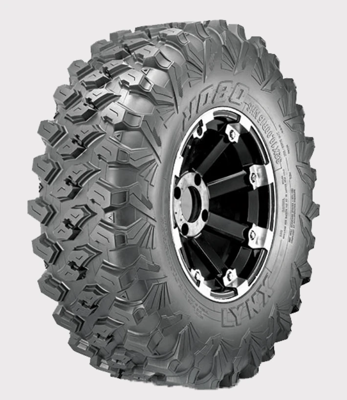 Obor Lynx WL15 32x10R15 mud tire for UTV, 8-ply, E-rated, advanced tread on black wheel.