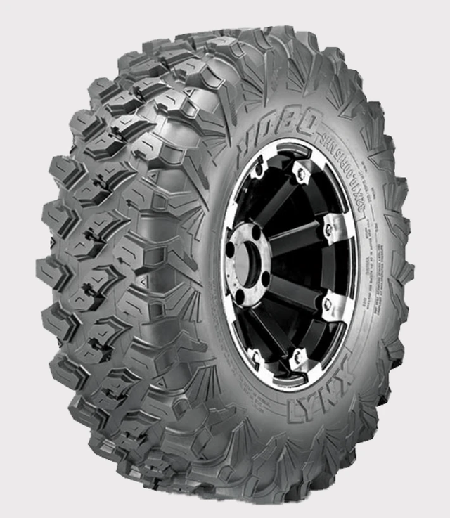 Obor Lynx WL15 32x10R15 mud tire for UTV, 8-ply, E-rated, advanced tread on black wheel.