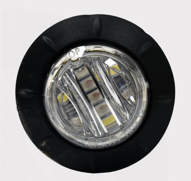 Road-legal 36mm amber LED indicator light with black rubber bezel