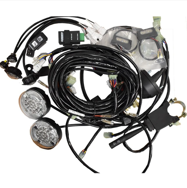 Road Legal Kit for Kawasaki Mule SX ATV by Quadtech UK with two round LED lights and wiring harness.