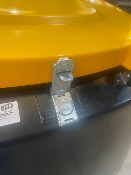 JFC Agri lockable Easy Empty Cubic Metre Meal Bin, yellow top with metal latch on black base
