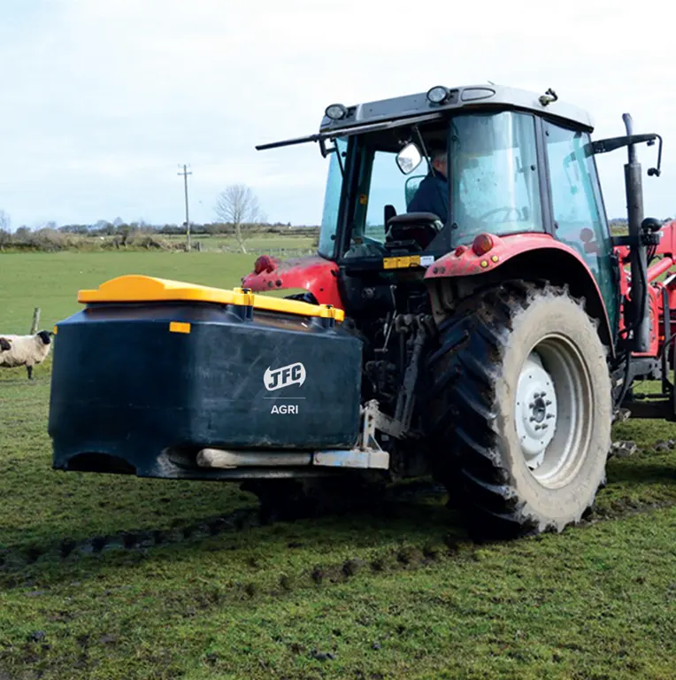 Cubic Metre Meal Bin (CMB04) by JFC Agri, a blue feed storage bin with a yellow lid attached to a tractor.