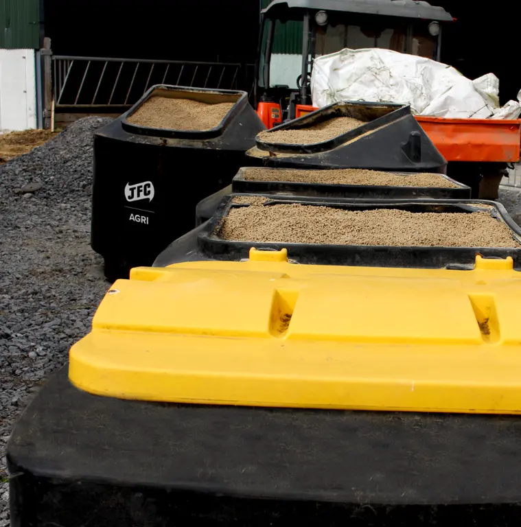 Cubic Metre Meal Bin CMB04 by JFC Agri, 3 black livestock feed storage bins with grain.