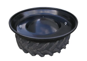 Round black feeder trough on a tyre platform (RFL2) by JFC Agri