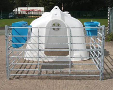 JFC Agri White Compact Group Calf Hutch with 4-teat milk feeder, blue buckets and metal pen fencing