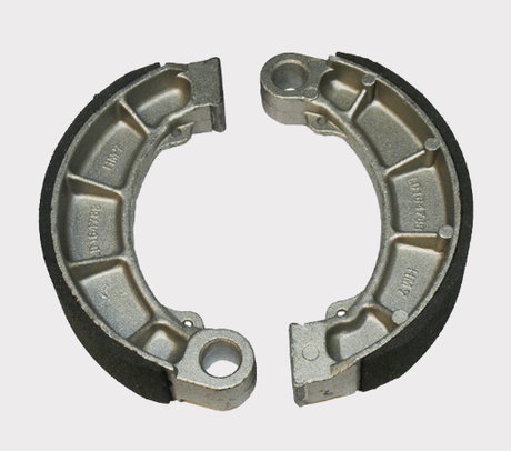 Brake shoes pair for Honda TRX Rancher/Foreman ATV (1995–2023); metallic gray with black friction lining