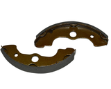 Front brake shoes pair for Honda TRX ATV models; brown friction material, metal backing