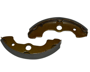 Front brake shoes pair for Honda TRX ATV models; brown friction material, metal backing