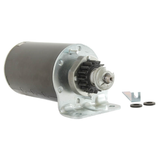 Starter motor with black housing and silver mounting flange; drive gear visible.