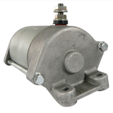 Starter motor with cast metal housing, metallic gray finish, and mounting bolts.
