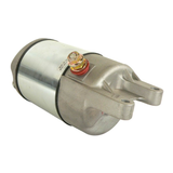 Starter motor for Honda TRX350D (1986); silver metal body, red terminal lug, OEM 31200-HA7-305