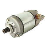 Starter motor for ATV Honda TRX350D 1986; silver cylindrical body, black end housing, red terminal.