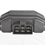 Regulator rectifier module with a 6-pin plug, black plastic housing for ATV voltage regulation.