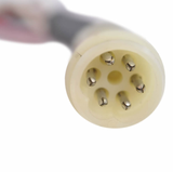 Regulator Rectifier connector; circular cream plastic housing with seven metal pins.