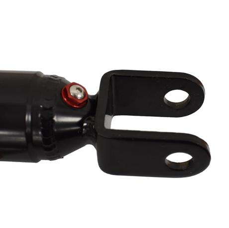Hyper rear shock absorber with black body and red mounting bolt at clevis end