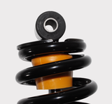 Front shock absorber by Hyper; orange coil spring, black housing for John Deere Gator XUV.