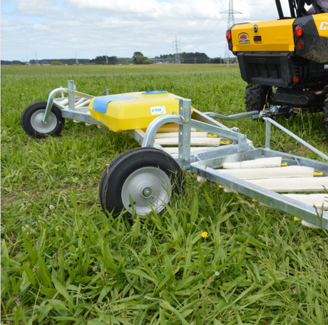 C-Dax Eliminator On-Board Tank 50L weed wiper sprayer with yellow tank and 12V pump on a wheeled trailer in a field