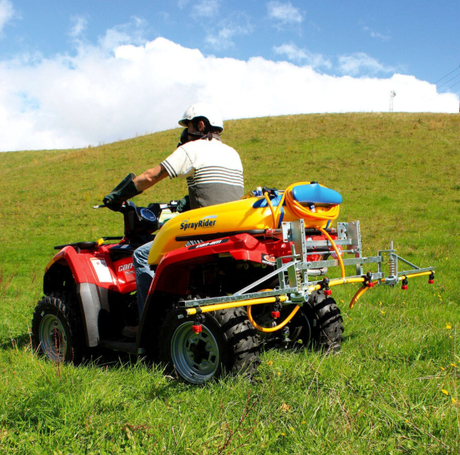 C-Dax SprayRider 50 G2 ATV spot sprayer with 50L yellow tank mounted on a red ATV.