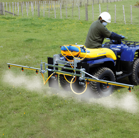 C-Dax ATV 4m folding spray boom mounted on a blue-and-yellow ATV with orange hoses and spray nozzles.