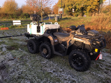 Fimco UTV sprayer with 65 gal tank and 12-ft folding boom mounted on a six-wheeled utility vehicle
