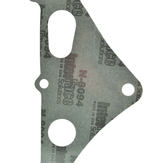 Stator cover gasket, gray fiber material with mounting holes.