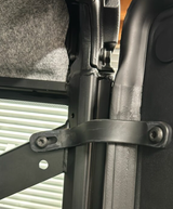 UTV door limit straps pair in black metal, mounted to Polaris Ranger door frame.