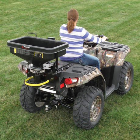 Fimco ATV Dry Material Spreader 12V DMS mounted on camo quad at rear