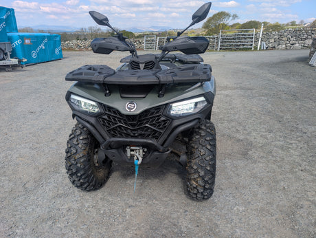 Used CFMOTO CFORCE 520 ATV front view; olive green body, rugged dual front racks, large all-terrain tires.