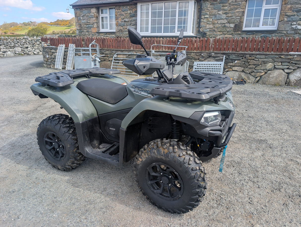 Used CFMOTO CFORCE 520 ATV with front and rear racks, olive-green body, rugged tires.