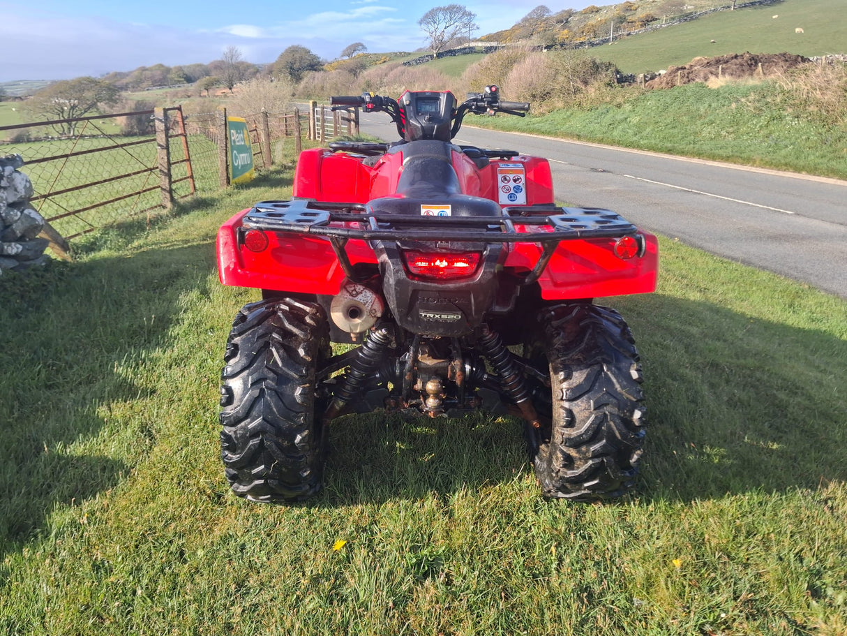 Used red Honda TRX 520 FM6 ATV by DGT Agri with manual transmission and rear cargo rack