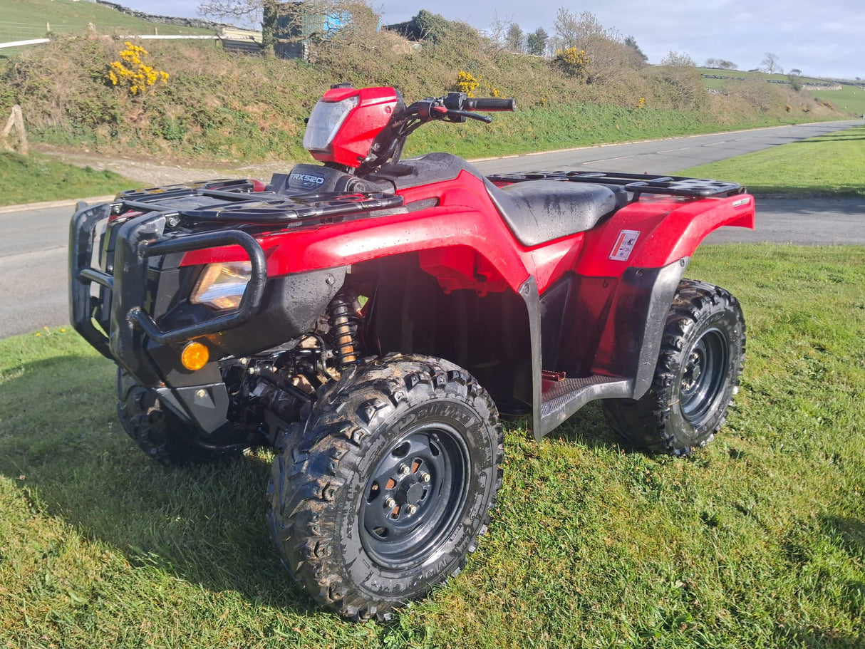 Used Honda TRX 520 FM6 manual ATV, red quad with front rack and rugged tires