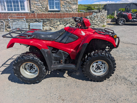 Honda TRX 500 ATV red rugged quad with front and rear racks