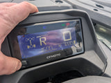 Used CFMOTO CFORCE 520 ATV instrument cluster with a hand on the housing; blue digital readout